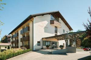 a large white building with balconies on it at App.-Haus zur Europa-Therme in Bad Füssing