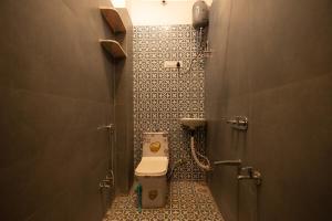 Ένα μπάνιο στο Adis Oasis 4 Bhk Tranquil Villa with pool