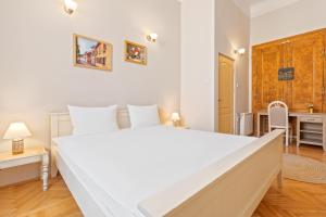 Postel nebo postele na pokoji v ubytování Elle Home