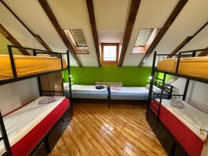 a room with three bunk beds in it at Hostel Vagabond in Sarajevo +54 photos