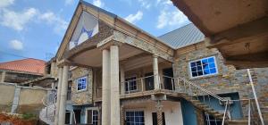 a building with a flag on the side of it at GV Homes and Apartments in Gbawe
