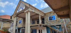 a building with a flag on the front of it at GV Homes and Apartments in Gbawe