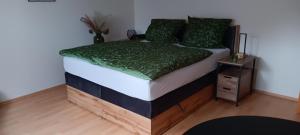 Postel nebo postele na pokoji v ubytování Ferienappartment Schneiderbanger