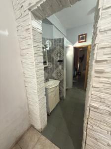 a bathroom with a sink and a toilet in a room at YBVerde in Yerba Buena