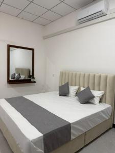 Postel nebo postele na pokoji v ubytování Grand Jay