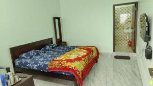 Voodi või voodid majutusasutuse Magic Mist Inn Yercaud toas