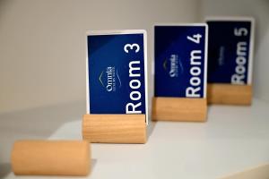 een groep van drie boeken zittend op een tafel bij Omnia Luxury Suite in Salerno