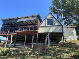 a house that is being built on a hill at Doa Blanca Cabin Mountain View in Utuado