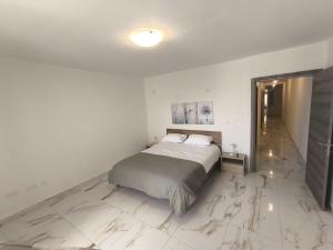 Ένα ή περισσότερα κρεβάτια σε δωμάτιο στο Il-Gawwija Suite Sannat