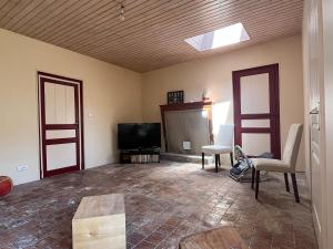 Μια τηλεόραση ή/και κέντρο ψυχαγωγίας στο Maison unique avec chasse au trésor