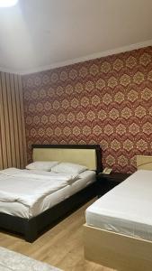 Ένα ή περισσότερα κρεβάτια σε δωμάτιο στο Seoul Hotel