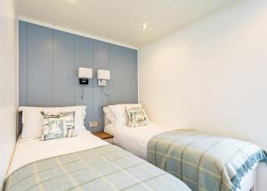 Voodi või voodid majutusasutuse Woodside Bay Lodge Retreat toas +65 fotot