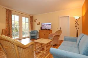 TV a/nebo společenská místnost v ubytování Ostseewelle Wohnung 06