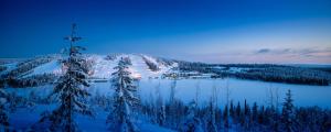 a winter scene of a town on a snowy mountain at Ukkohalla Chalets in Hyrynsalmi