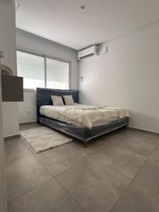 Ένα ή περισσότερα κρεβάτια σε δωμάτιο στο Queen marsa