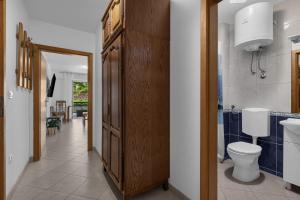 a bathroom with a toilet and a sink at Apartments Harmony of Five in Makarska +54 photos