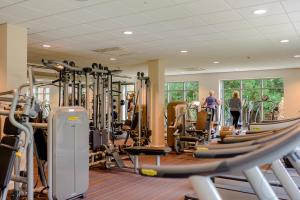 a gym with a bunch of treadmills and machines at Landal Kenwick Woods in Louth