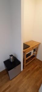 a room with a desk and a table and a table at Near Train Station in Rennes