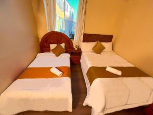 Un pat sau paturi într-o cameră la Hostal El Pino