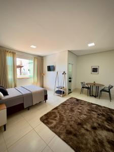 Ένα ή περισσότερα κρεβάτια σε δωμάτιο στο Rancho Palmeira Jardim +31 φωτογραφίες