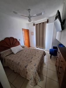 Ένα ή περισσότερα κρεβάτια σε δωμάτιο στο Hotel Las Palomitas +21 φωτογραφίες