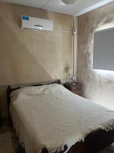 Ένα ή περισσότερα κρεβάτια σε δωμάτιο στο Quinta Atardeceres