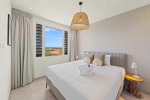 Postel nebo postele na pokoji v ubytování Caribbean Lounge - Aquamarine 4