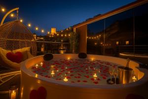 a bath tub with candles in it on a balcony at La Suite Secreta del Júcar in Alcalá del Júcar
