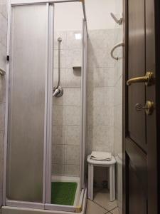 a shower with a glass door in a bathroom at Il Rifugio in Celano +26 photos