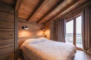 Ένα ή περισσότερα κρεβάτια σε δωμάτιο στο Chalet du Gouter +139 φωτογραφίες