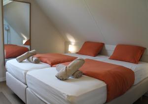 Postel nebo postele na pokoji v ubytování Fero Breskens - Modern & kindvriendelijk vakantiehuis op wandelafstand van het strand + 47 fotografií