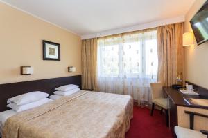 Postel nebo postele na pokoji v ubytování Hotel Rocca al Mare