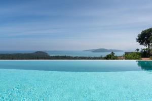 a swimming pool with a view of the water at Sea Breeze Villa in Amphoe Koh Samui +65 photos