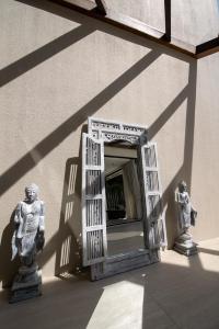 an open door on the side of a building at Sea Breeze Villa in Amphoe Koh Samui