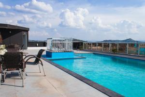 a swimming pool on the roof of a building at Atrium Express Hotels in Parauapebas