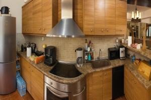 a kitchen with a sink and a stove at Wood & Chill in Elevtherokhórion