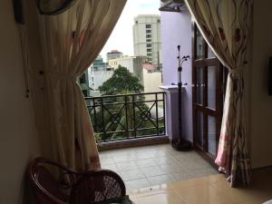 a balcony with a view of a city at Sunny B Hotel in Hue