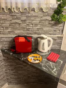 Kohvi ja tee valmistamise võimalus majutusasutuses Green Lake Airport Apartments