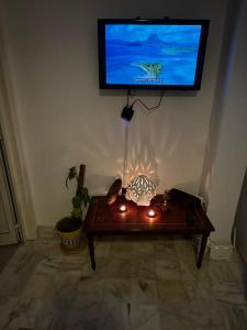 Μια τηλεόραση ή/και κέντρο ψυχαγωγίας στο Appartement s1 vue mer à la marsa