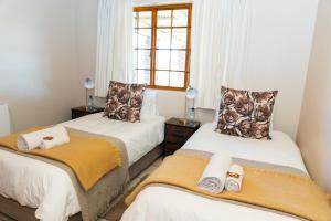 Postel nebo postele na pokoji v ubytování Geluk Farmhouse