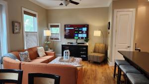a living room with a couch and a table at Coastal Dunes Escape in Santa Rosa Beach
