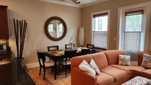 a living room with a couch and a table at Coastal Dunes Escape in Santa Rosa Beach +18 photos