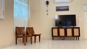 Μια τηλεόραση ή/και κέντρο ψυχαγωγίας στο Grace Cottage, Ayoor