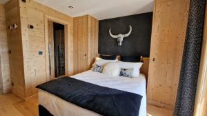 Ένα ή περισσότερα κρεβάτια σε δωμάτιο στο Chalet 1ère Étoile une vue à couper le souffle