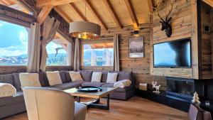 Μια τηλεόραση ή/και κέντρο ψυχαγωγίας στο Chalet Papa Shelter vue époustouflante