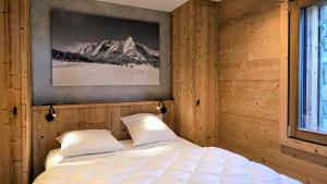 Ένα ή περισσότερα κρεβάτια σε δωμάτιο στο Chalet Papa Shelter vue époustouflante