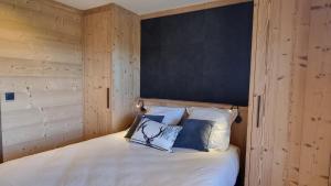 Ένα ή περισσότερα κρεβάτια σε δωμάτιο στο Chalet Sjodammen Jacuzzi vue époustouflante