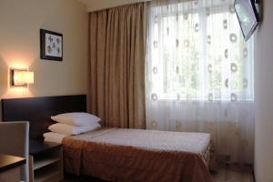 Postel nebo postele na pokoji v ubytování Hotel Rocca al Mare