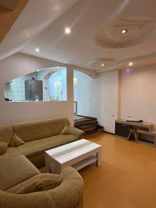 a living room with a couch and a coffee table at CENTRUM 22 RESIDENCE Ap II in Sibiu