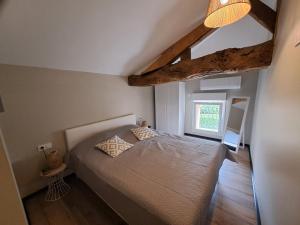a bedroom with a bed and a window at Le Gîte du Pêcheur, en campagne pour 10 personnes, Piscine privée et jardin in Damazan +33 photos